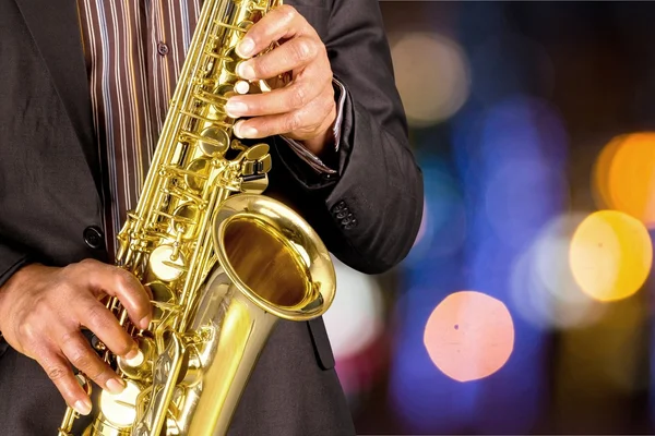 depositphotos_118713974-stock-photo-man-playing-on-saxophone